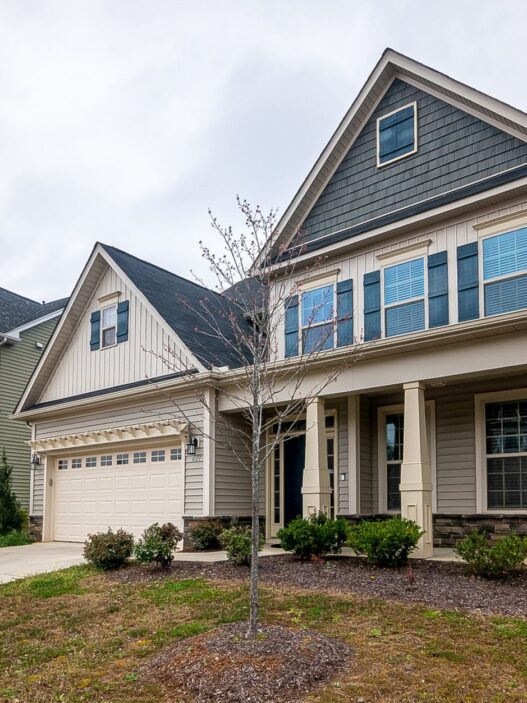 A suburban home exterior, illustrating homeowners insurance non-renewal and residual market options