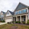 A suburban home exterior, illustrating homeowners insurance non-renewal and residual market options