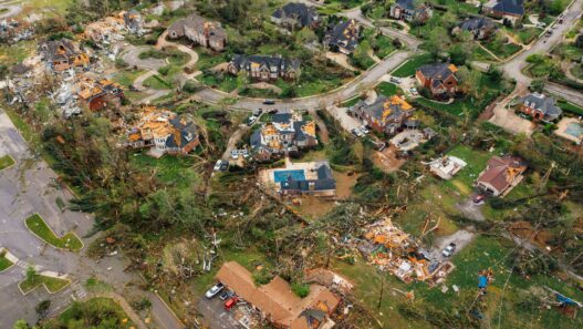 Storm-damaged roof on a house, illustrating how percentage hurricane deductibles are calculated