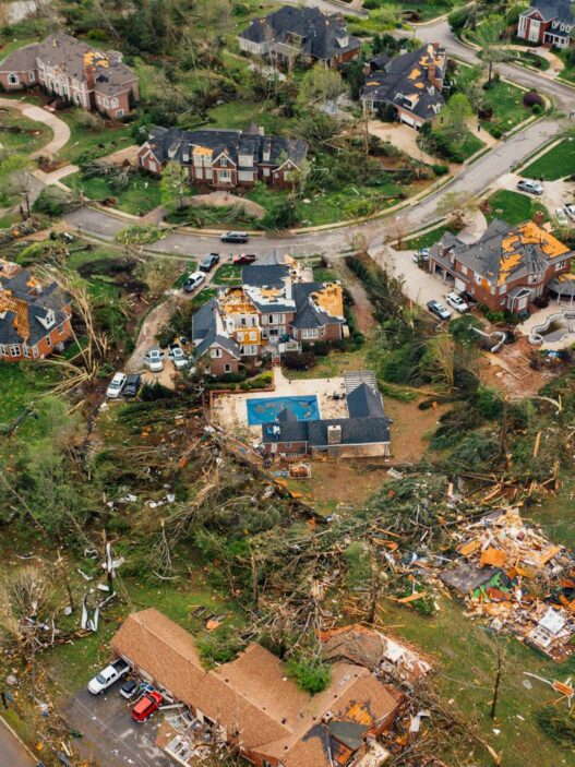 Storm-damaged roof on a house, illustrating how percentage hurricane deductibles are calculated