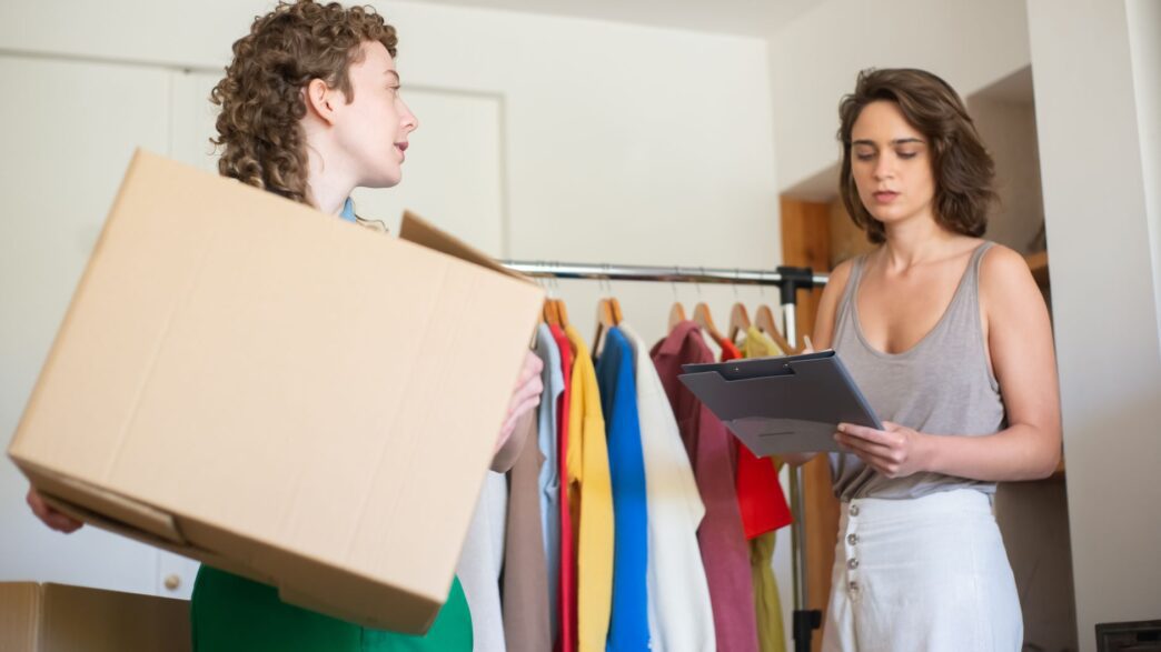 Folded secondhand clothing packed in a box ready to sell online