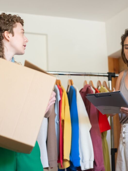 Folded secondhand clothing packed in a box ready to sell online