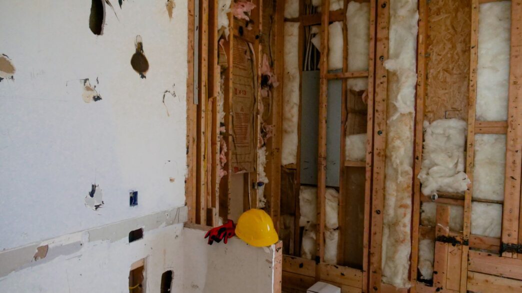 A house under construction showing framing work, illustrating code upgrade costs under ordinance or law coverage