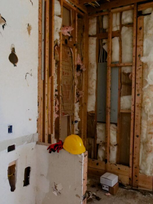 A house under construction showing framing work, illustrating code upgrade costs under ordinance or law coverage