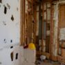 A house under construction showing framing work, illustrating code upgrade costs under ordinance or law coverage