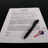 Renter reviewing a lease and rent paperwork at a kitchen table