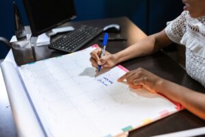 A desk calendar and planner used to schedule unused vacation days before the year ends