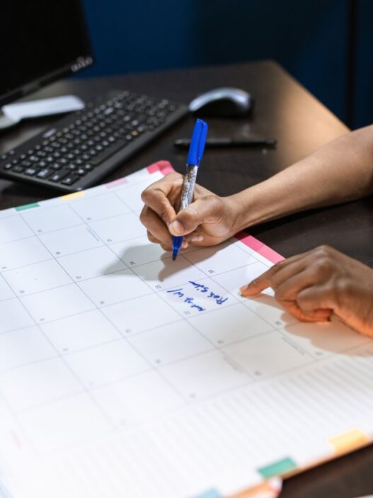 A desk calendar and planner used to schedule unused vacation days before the year ends