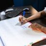 A desk calendar and planner used to schedule unused vacation days before the year ends