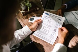 Person reviewing a credit report on a laptop at home