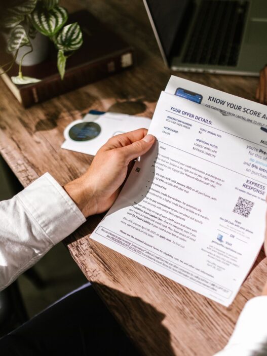 Person reviewing a credit report on a laptop at home