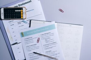 A monthly calendar and notebook used for planning a household budget