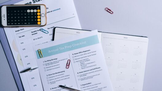 A monthly calendar and notebook used for planning a household budget