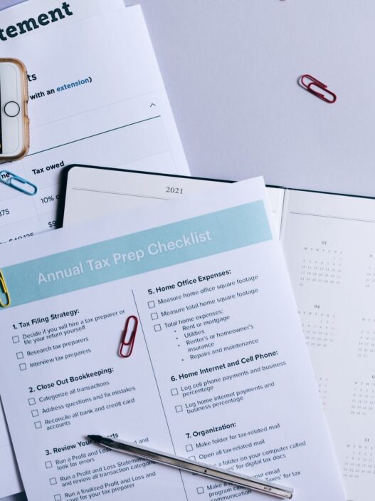 A monthly calendar and notebook used for planning a household budget