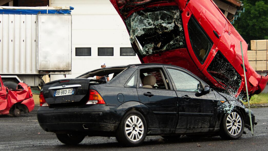 Two vehicles after a roadside collision, illustrating uninsured motorist coverage exposure