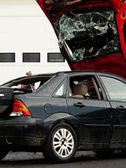 Two vehicles after a roadside collision, illustrating uninsured motorist coverage exposure