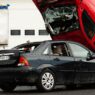 Two vehicles after a roadside collision, illustrating uninsured motorist coverage exposure