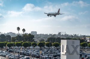 Rows of parked cars in an airport economy parking lot before holiday travel