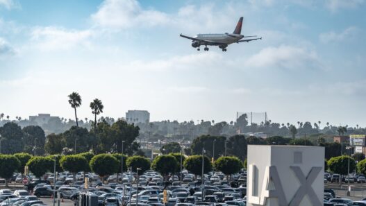 Rows of parked cars in an airport economy parking lot before holiday travel