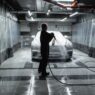 Car going through an automatic car wash tunnel covered in foam