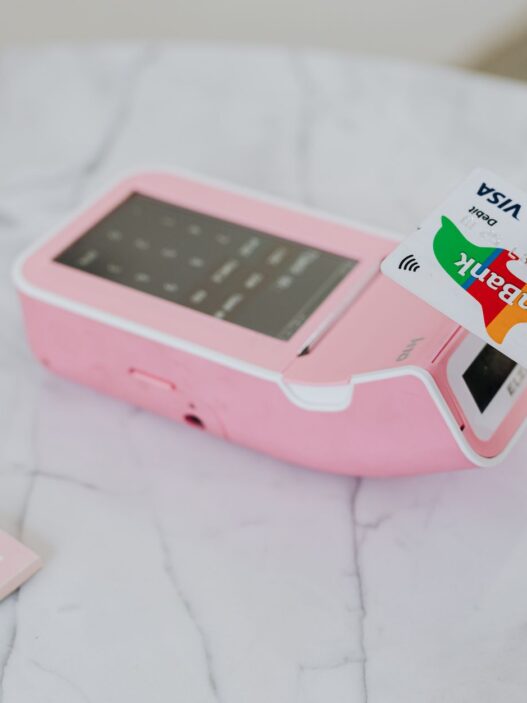 Shopper paying with a debit card at a store checkout terminal