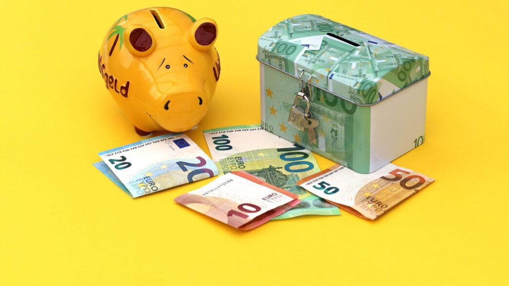 Piggy bank and wrapped gifts representing a Christmas club savings account