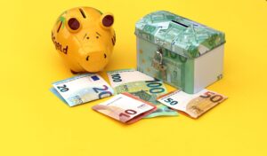 Piggy bank and wrapped gifts representing a Christmas club savings account