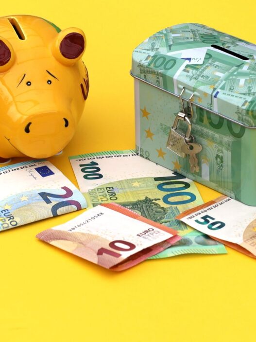 Piggy bank and wrapped gifts representing a Christmas club savings account