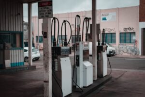 Driver refueling a car at a gas station pump, illustrating record September 2026 gas prices and fuel budgeting