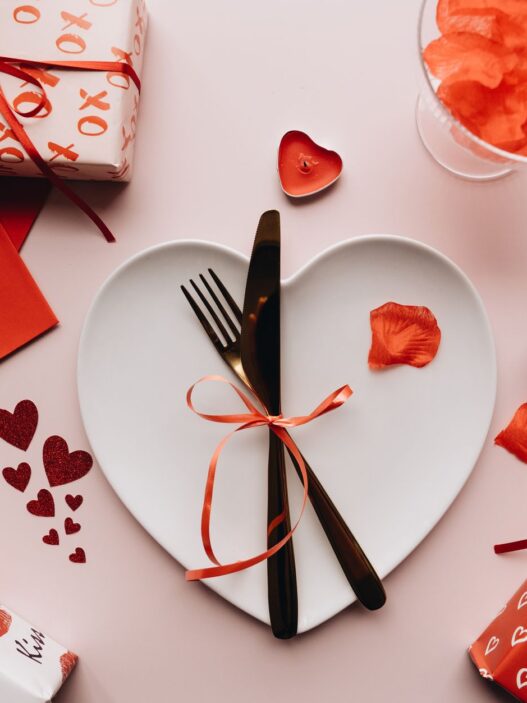 Diners sharing a restaurant meal, illustrating how to use holiday gift card bonus deals before they expire