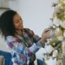 Decorated artificial Christmas tree in a living room, illustrating real vs artificial Christmas tree cost