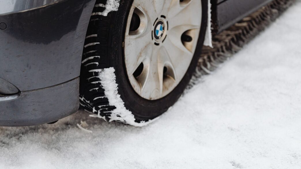 Car with winter tires on a snowy road