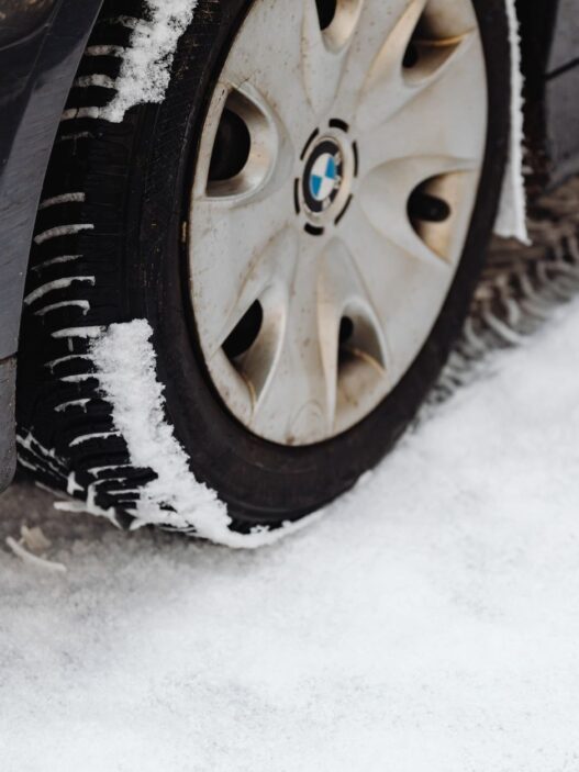 Car with winter tires on a snowy road
