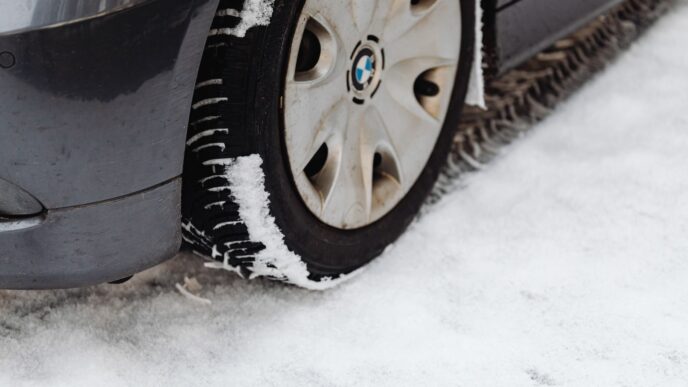 Car with winter tires on a snowy road