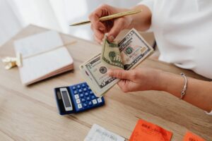 Monthly budget planner notebook with a calculator for a zero-based budget