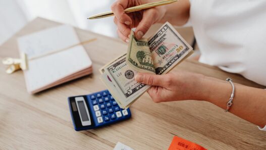 Monthly budget planner notebook with a calculator for a zero-based budget